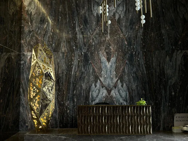 Book-matched dark marble wall behind a reception desk